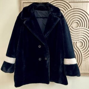 Fuzzy black and white coat.